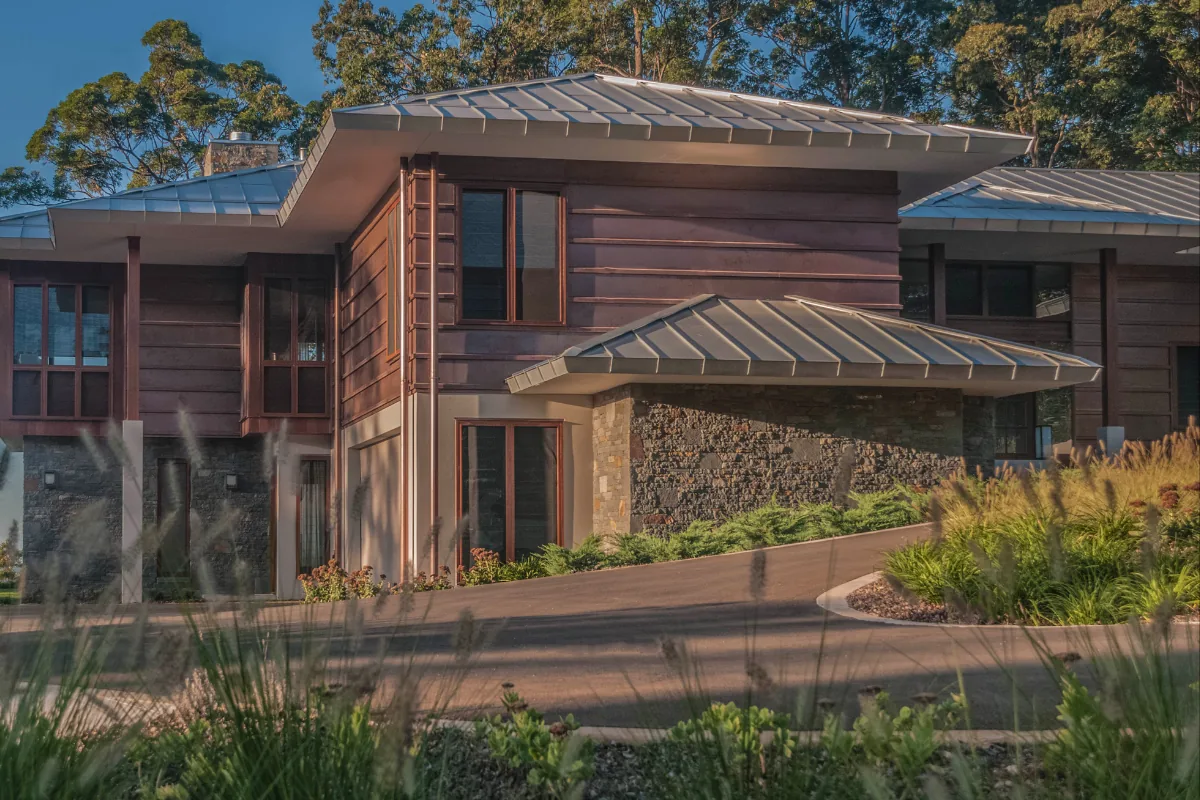 Euroclad copper and zinc cladding — Mount Tamborine hinterland estate at golden hour